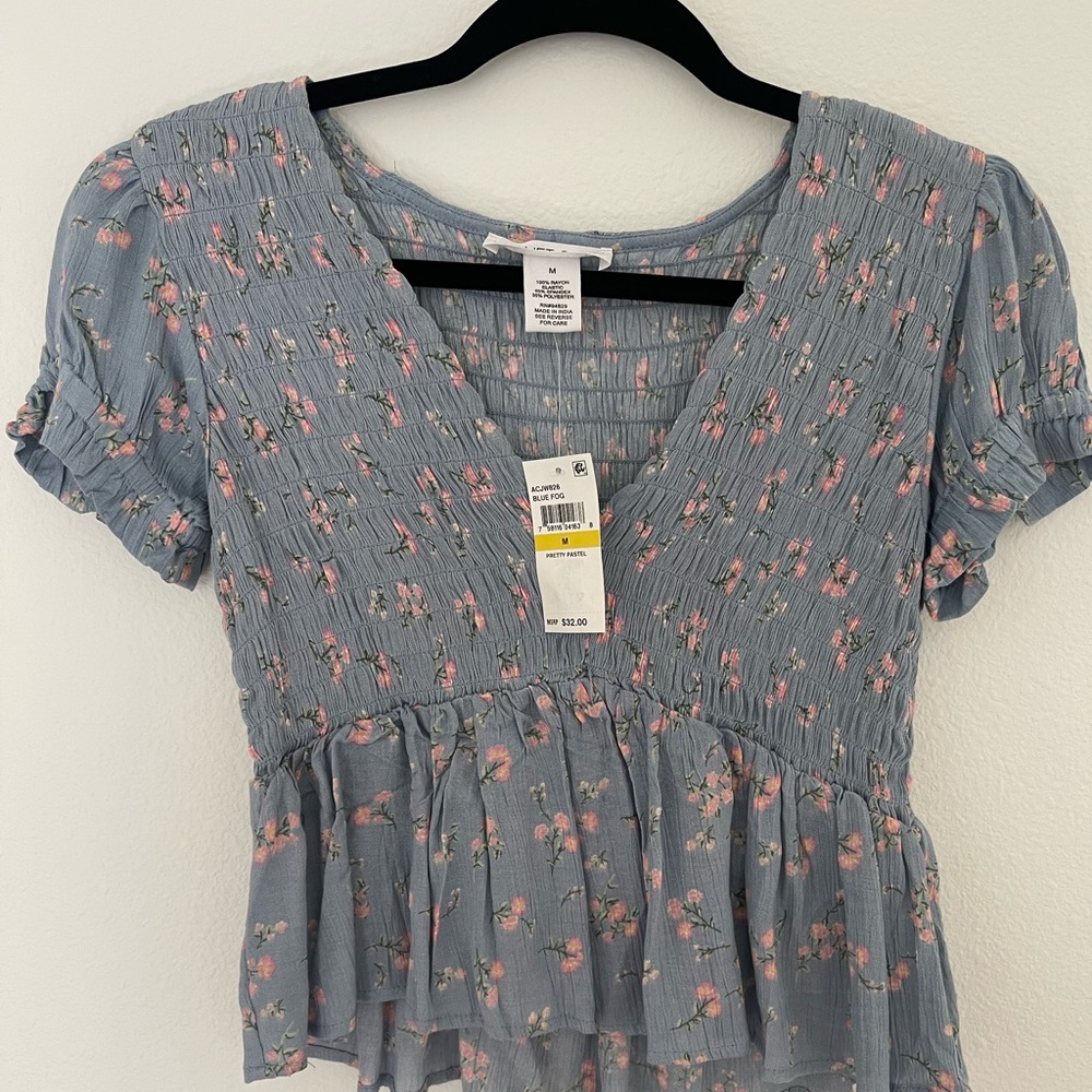 Brand new with tags. Supper cute top